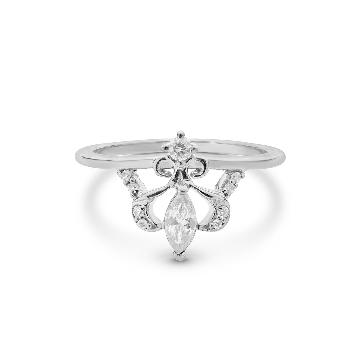 Silver ring with a decorative design and clear gemstone on a white background