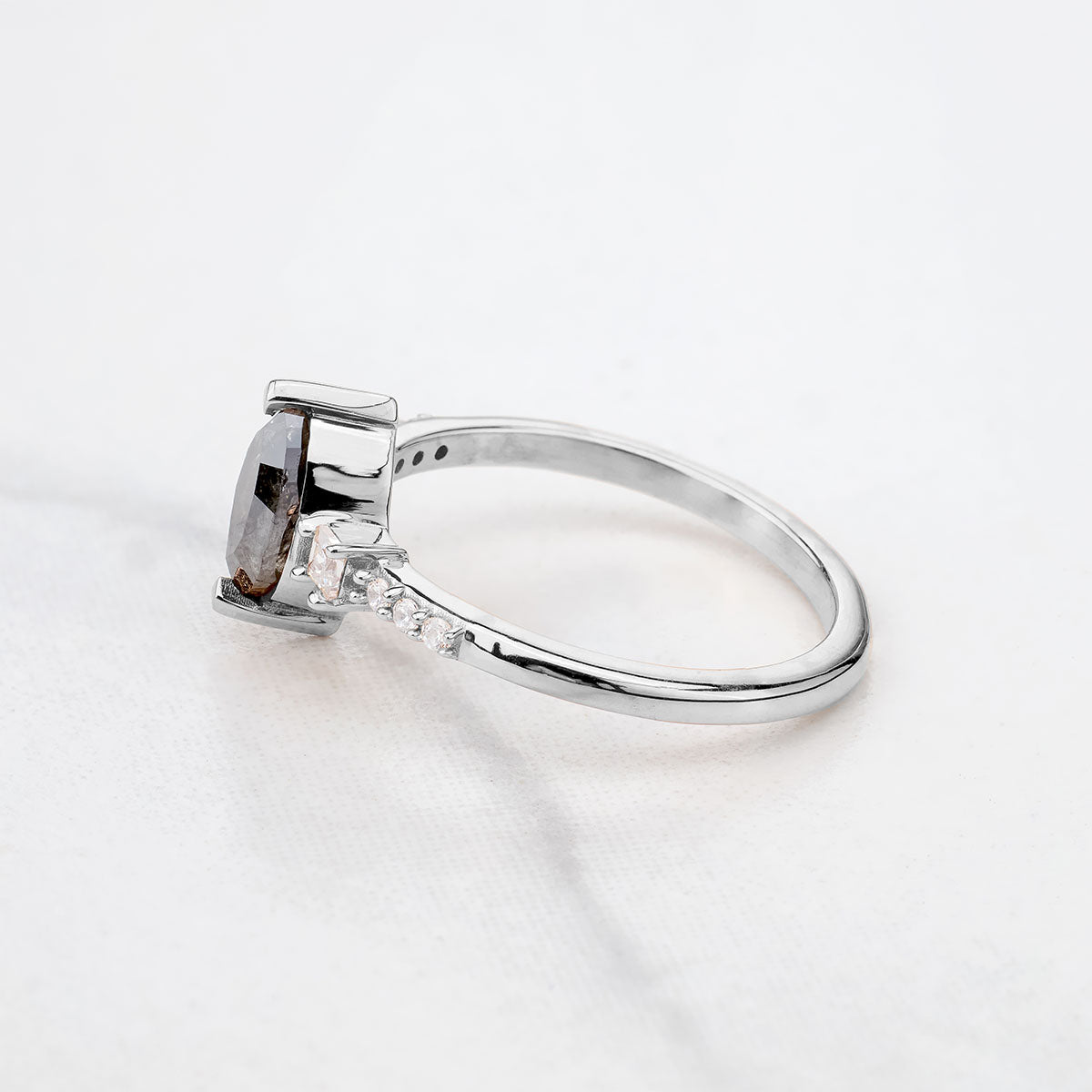 White gold salt and pepper diamond ring side view with marquise center stone, a unique anniversary or birthday gift idea for her