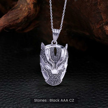 Silver panther pendant necklace with black stones on a dark textured background