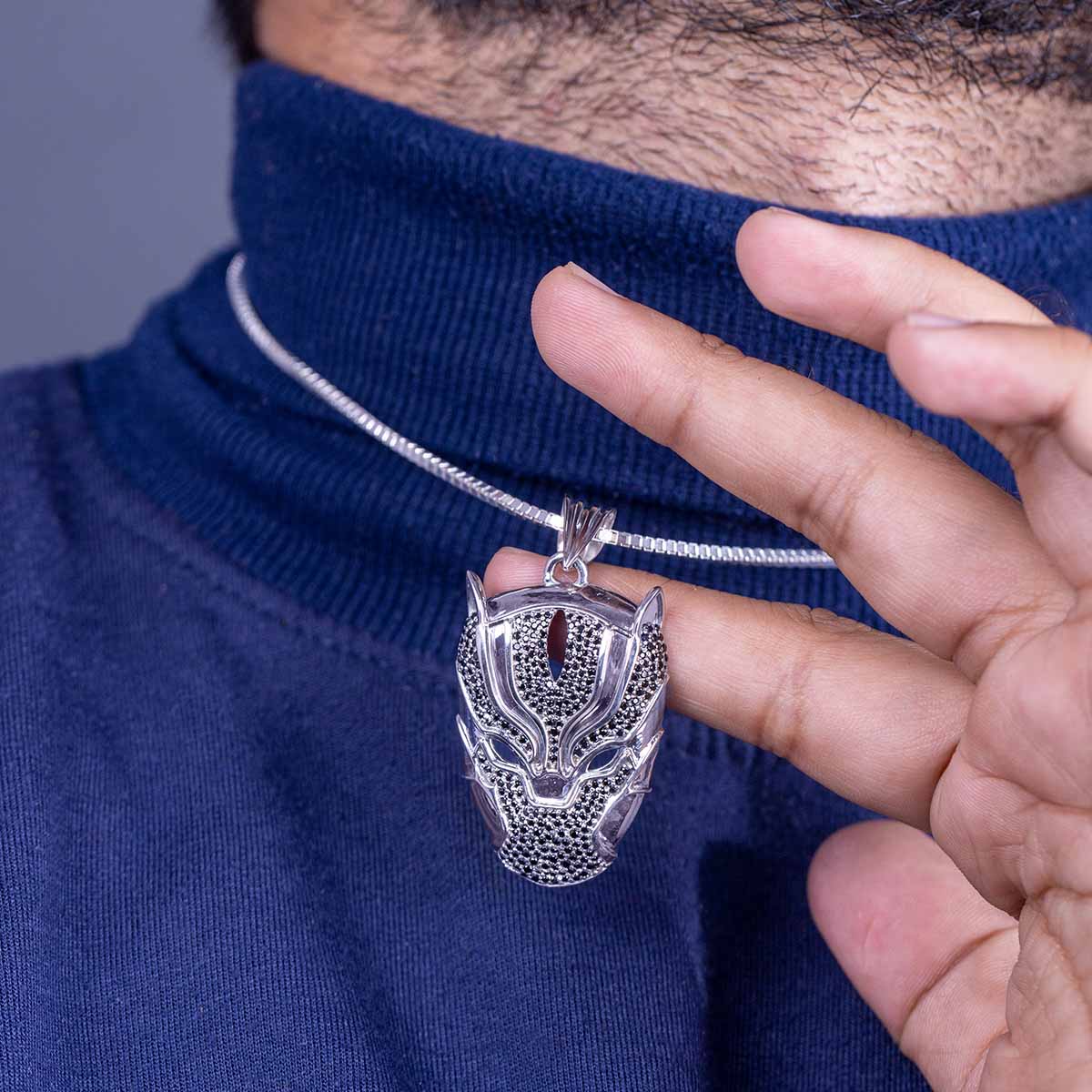 panther pendant necklace worn by a person