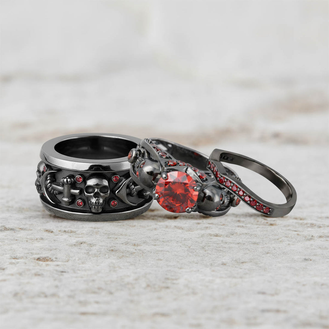 matching black skull wedding ring set of 3 pieces, crafted in sterling silver with red garnet gemstones