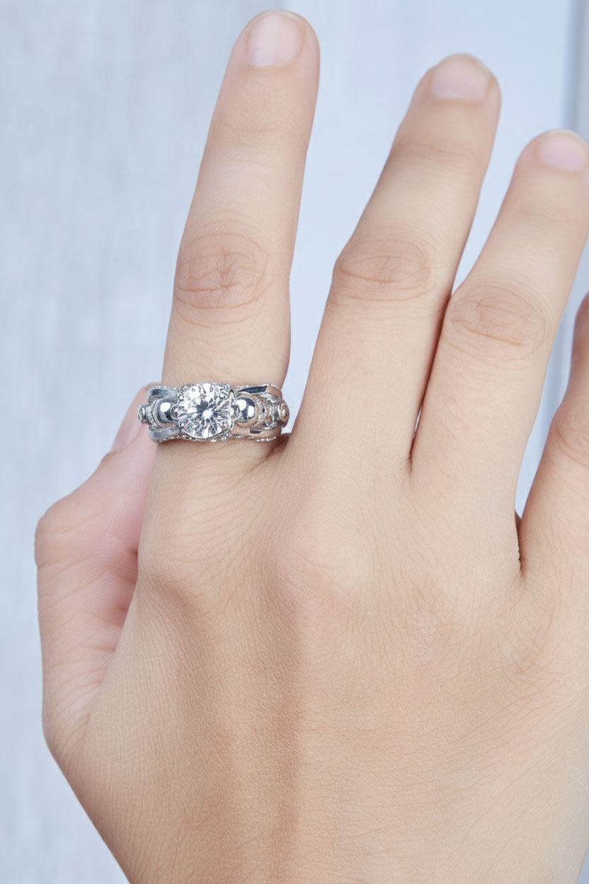 Hand wearing a diamond skull ring