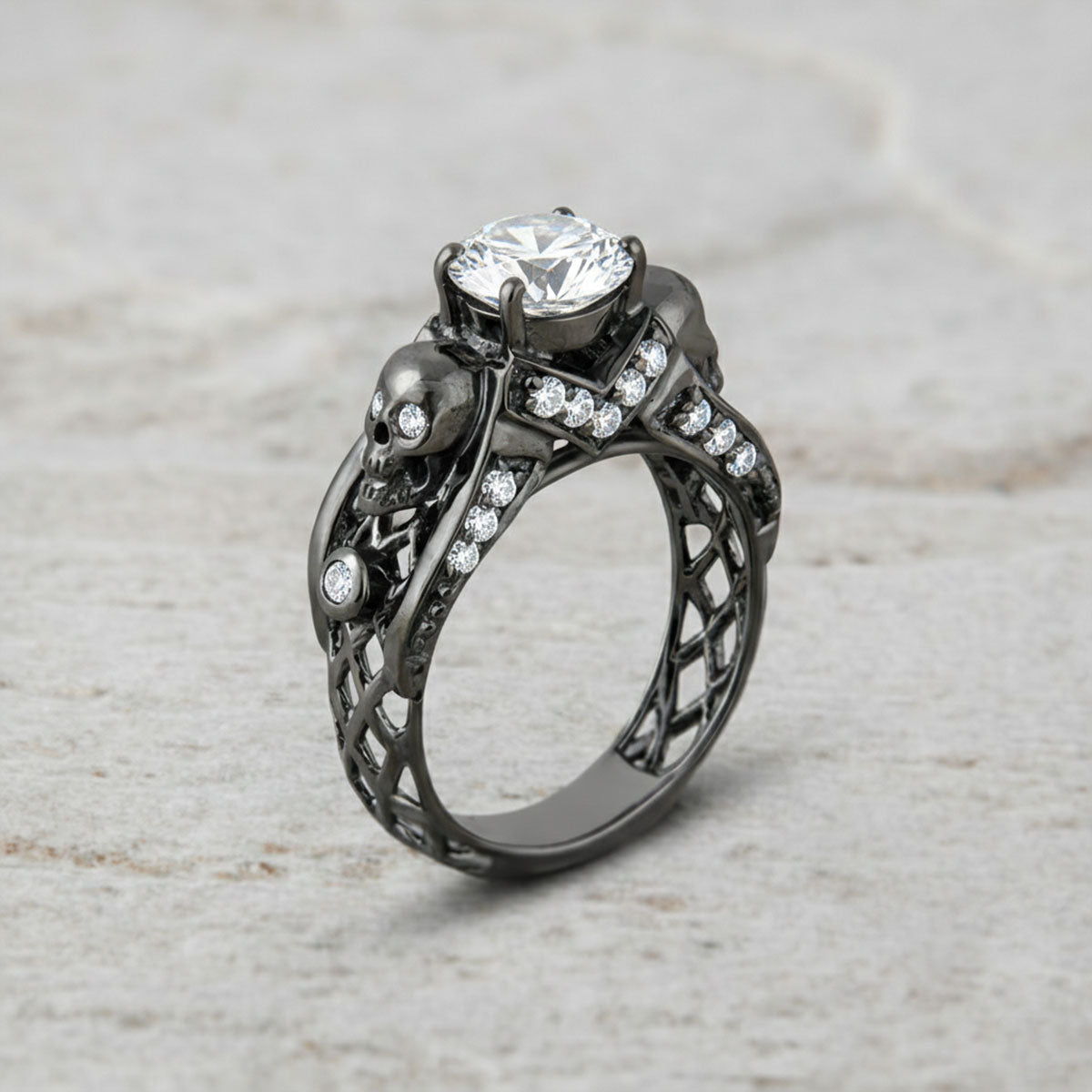 black skull ring with diamond and criss cross mesh design band