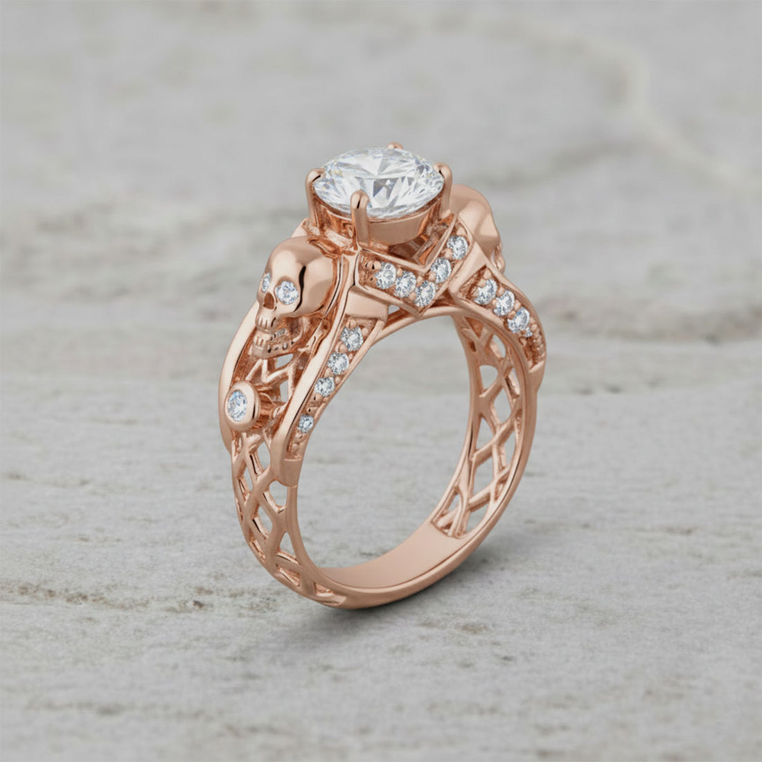 Rose gold skull ring with criss cross mesh design and diamond