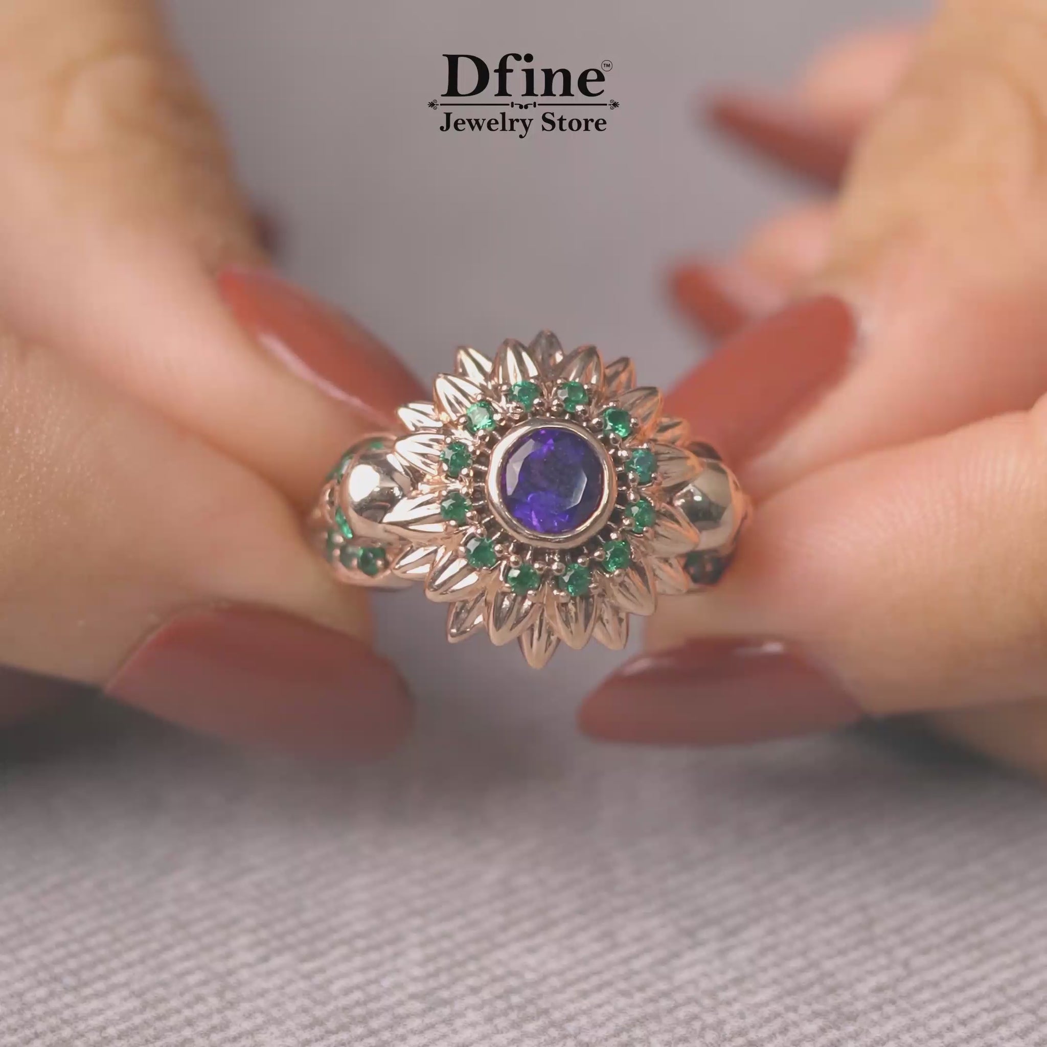 skull flower statement engagement ring with purple amethyst and green emerald gemstones in rose gold