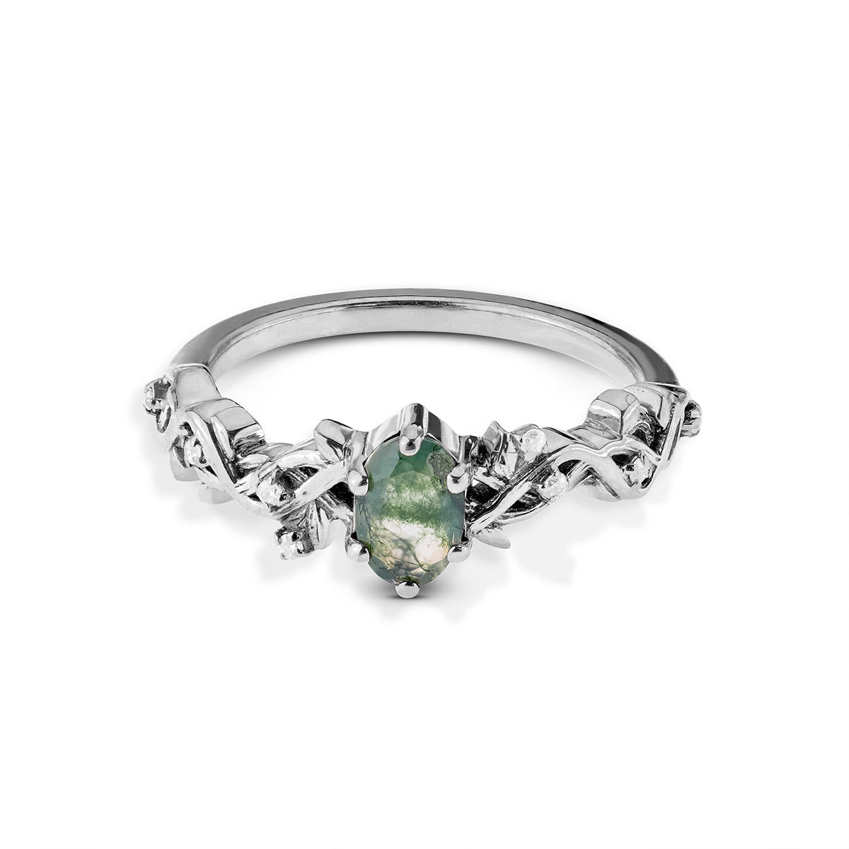 Silver ring with a green gemstone on a white background