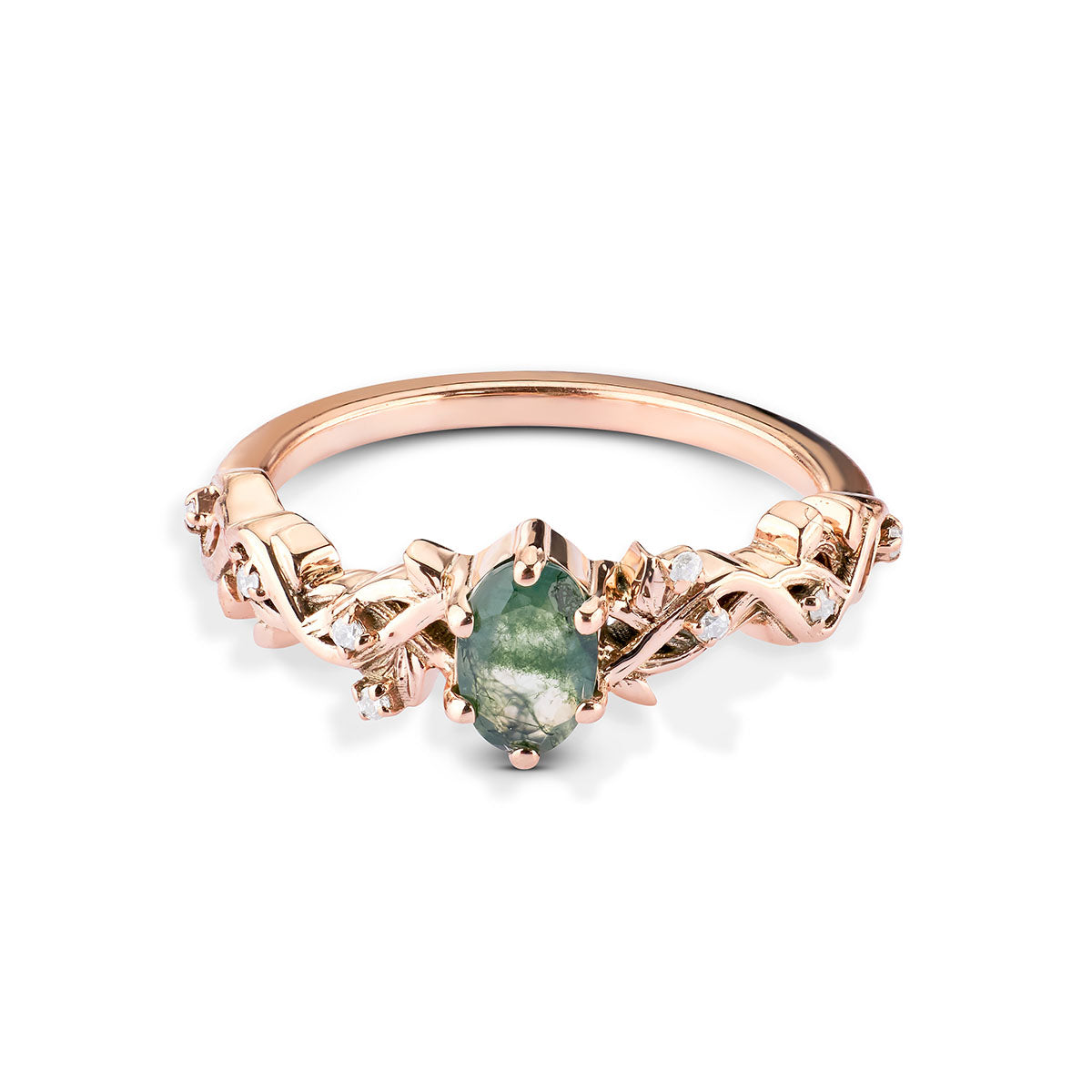 Rose gold ring with a green gemstone on a white background