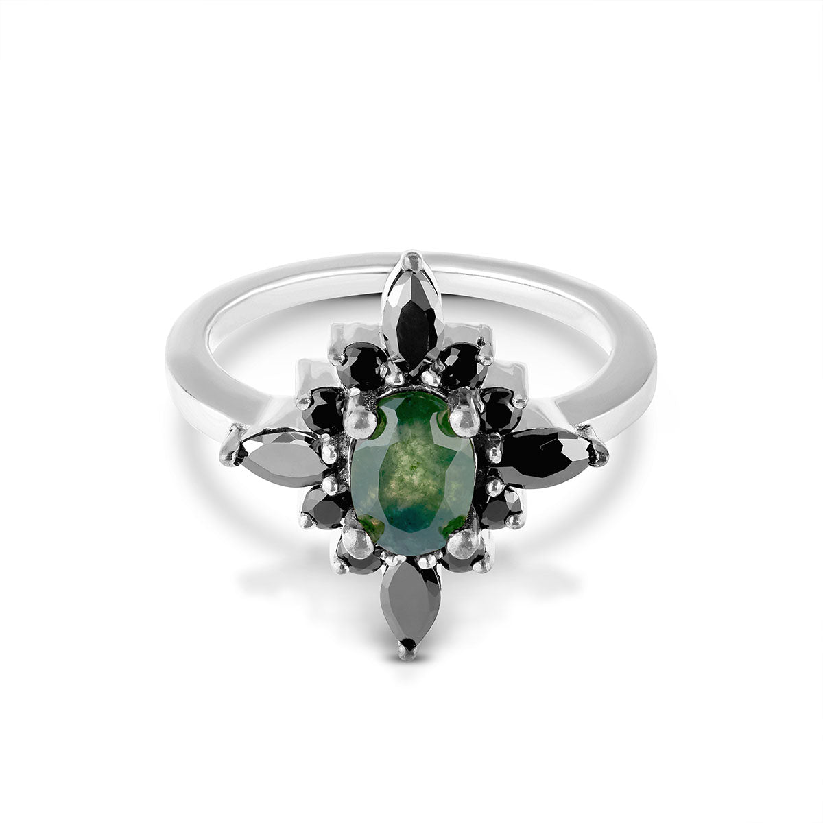 Vintage-inspired silver ring featuring a green center stone and a gothic black gem halo.